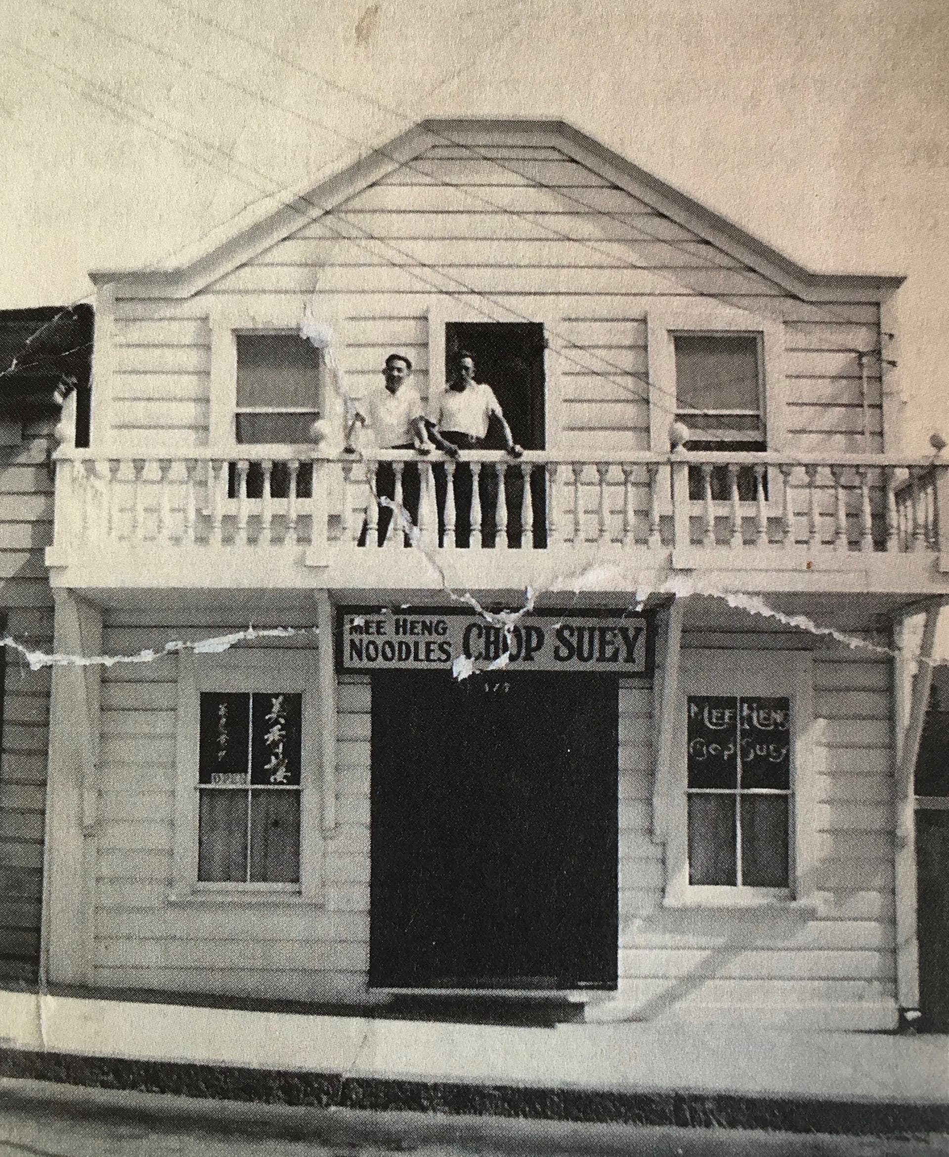 Historic black and white photo of the Mee Heng Low noodle shop in 1940